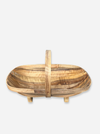 A rustic wooden basket bowl with a vertical handle, crafted from natural wood with prominent grain patterns, shown against a light gray background.