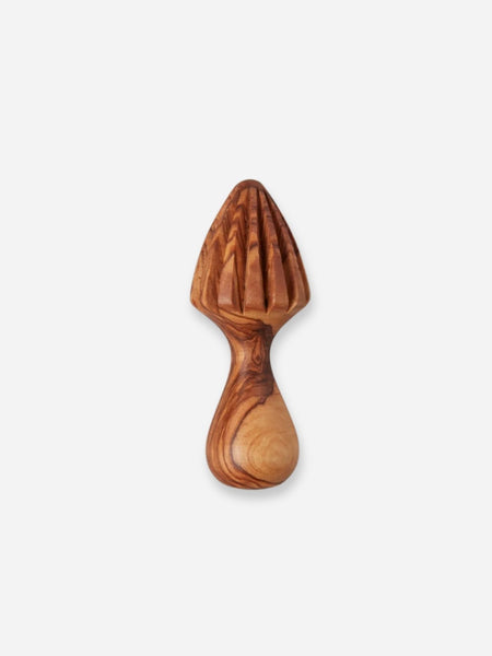 A wooden citrus juicer with a ribbed suction-style top and a curved handle, shown on a plain light gray background.