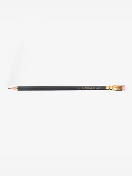 A single black pencil with gold lettering and a pink eraser, shown horizontally against a plain white background.