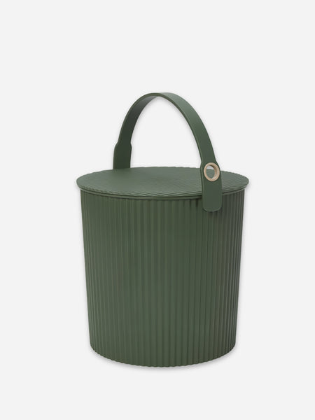 An olive green ribbed plastic bucket with a matching lid and a single top handle, featuring a small gold-tone metal accent on the strap, set against a plain light gray background.