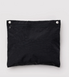 A black zippered pouch with two silver metal snap buttons on the top edge, shown against a light gray background.