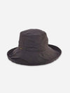 A dark charcoal gray wide-brimmed bucket hat with a small gold logo on the side, displayed against a light gray background.