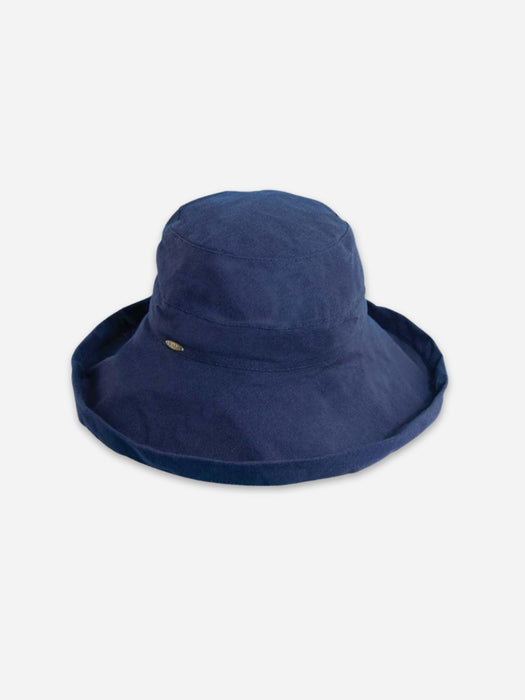 A navy blue bucket hat with a small gold logo on the side, photographed against a light gray background.