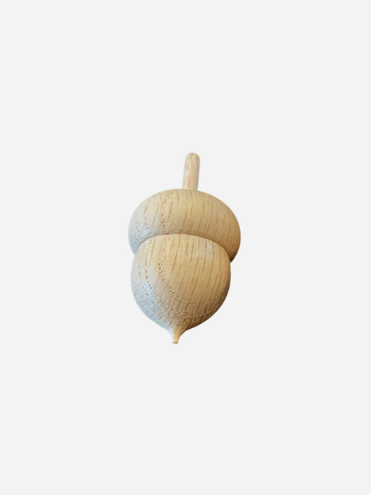 A small unfinished wooden acorn toy with a natural light wood finish, shown against a plain light gray background.