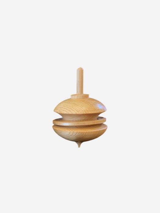 geometric wooden spinning top toy on a white background