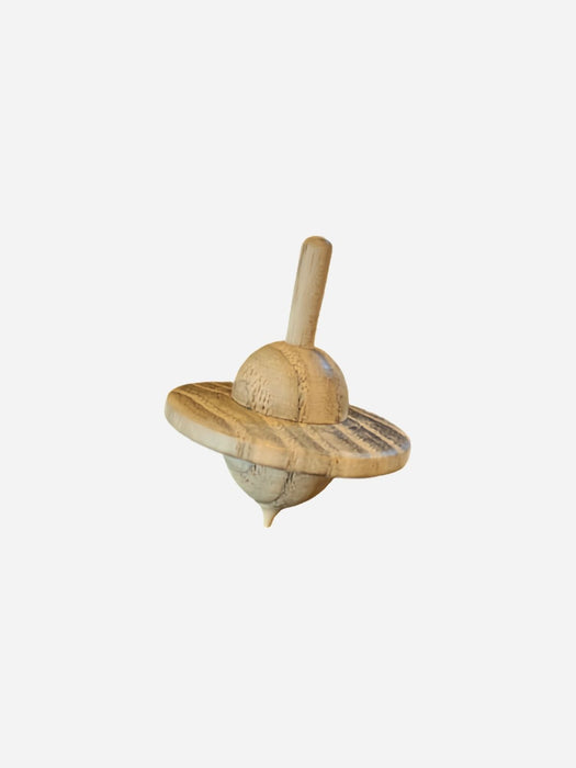 A small wooden toy spinning top with a natural light brown finish, shown against a plain light gray background.