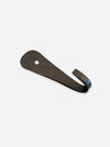 A rustic black metal hook with a flat, elongated head featuring a pre-drilled hole, shown on a light gray background.