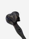 A black cast iron wall hook with a sculpted dog head handle, shown against a plain light gray background.