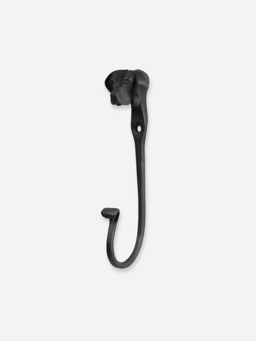 A black metal wall hook shaped like a stylized dog head, shown against a plain light gray background.