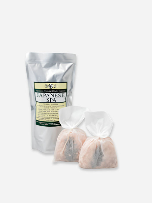 A silver stand-up pouch labeled Japanese Spa, shown with two small translucent drawstring bags containing light pinkish-beige contents, on a plain light gray background.