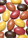 A group of oval-shaped beige bars of scented soaps shown on a plain light gray background.