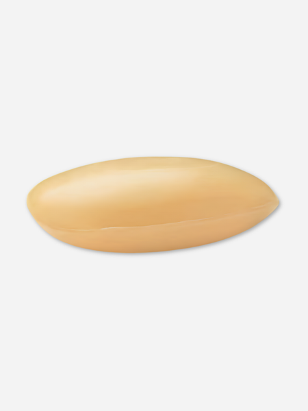 A single oval-shaped beige bar of sandalwood scented soap shown on a plain light gray background.