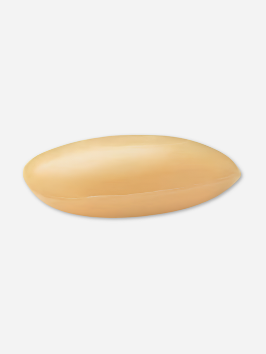 A single oval-shaped beige bar of sandalwood scented soap shown on a plain light gray background.