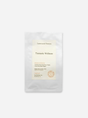 matte white pouches of herbal tea, with the front pouch labeled 'Leaves and Flowers Turmeric Wellness' standing in front of a second pouch on a light gray background.