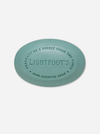 A round, light blue-green bar of soap with embossed text reading 'LIGHTFOOT'S PINE-SCENTED SOAP' on a clean, light gray background.