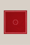 A square red scarf with a white micro-dot pattern, featuring a central circular motif and a decorative border, displayed flat against a neutral light gray background.