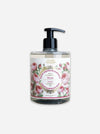 A clear plastic pump bottle of Maison des Sens Rose French Liquid Gardening Oil with a black pump dispenser and a floral rose label, set against a plain light gray background.