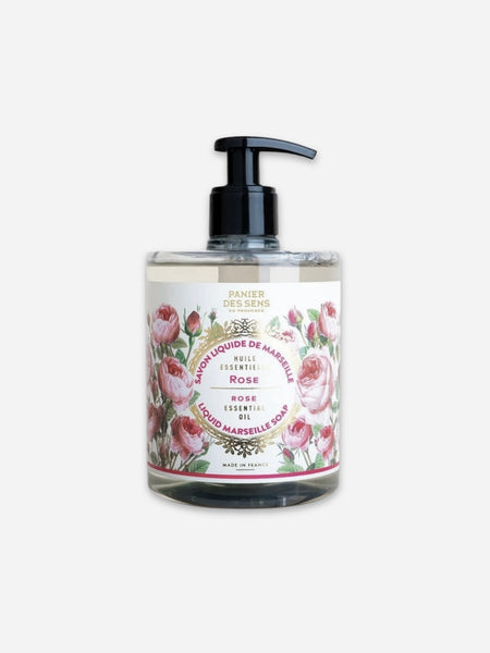A clear plastic pump bottle of Maison des Sens Rose French Liquid Gardening Oil with a black pump dispenser and a floral rose label, set against a plain light gray background.
