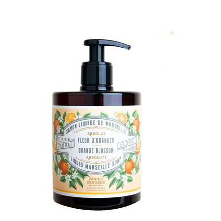 Amber plastic pump bottle of liquid Marseille soap with a black dispenser, featuring a cream label with orange illustrations on a white background.