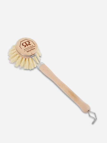 A wooden-handled cleaning brush with a round natural wood head, cream-colored bristles, and a metal hook at the end, shown on a light gray background. The head is branded with the Redecker logo.
