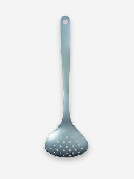 A stainless steel slotted ladle with a long handle and hanging hole, shown against a plain light gray background.