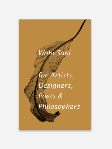 A book cover for 'Wabi-Sabi for Artists, Designers, Poets & Philosophers' by Wabi-Sabi, featuring a warm ochre background with a dark brown dried leaf illustration and white text.