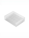 A translucent white silicone or plastic soap tray with a grid of small upright prongs, shown on a plain white background.