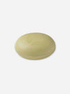 A round, pale yellow bar of soap embossed with the words 'La Lavande' and a floral design, set against a plain white background.